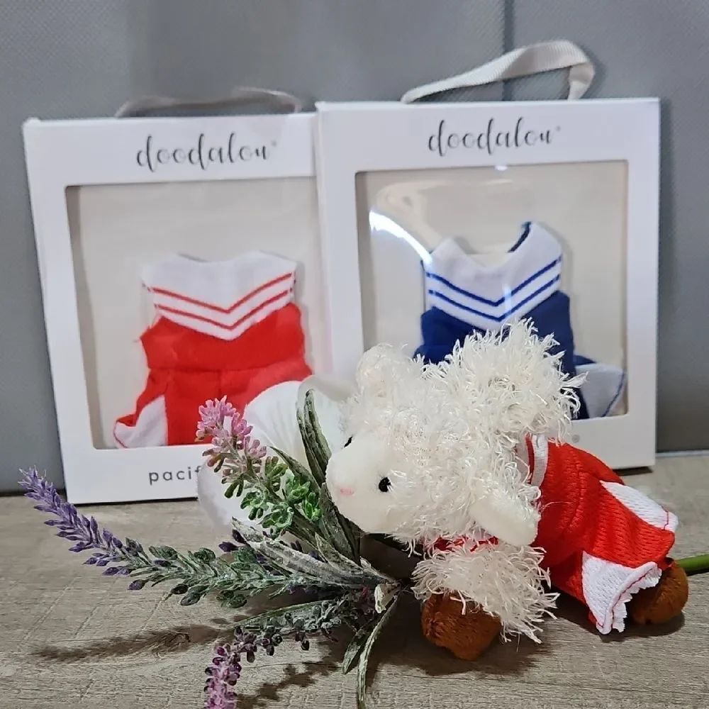 Doodalou Set Of Two Cheerleader Pacifier Attire & White Sheep (Blue & Red)